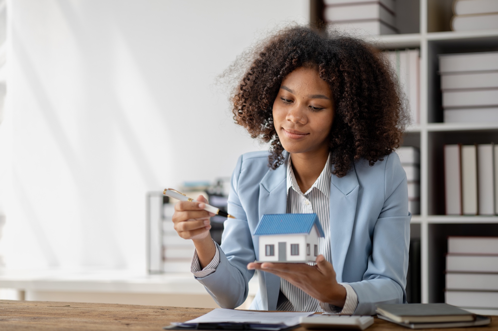 An American woman is a land and real estate broker for houses and condos, she is a real estate broke