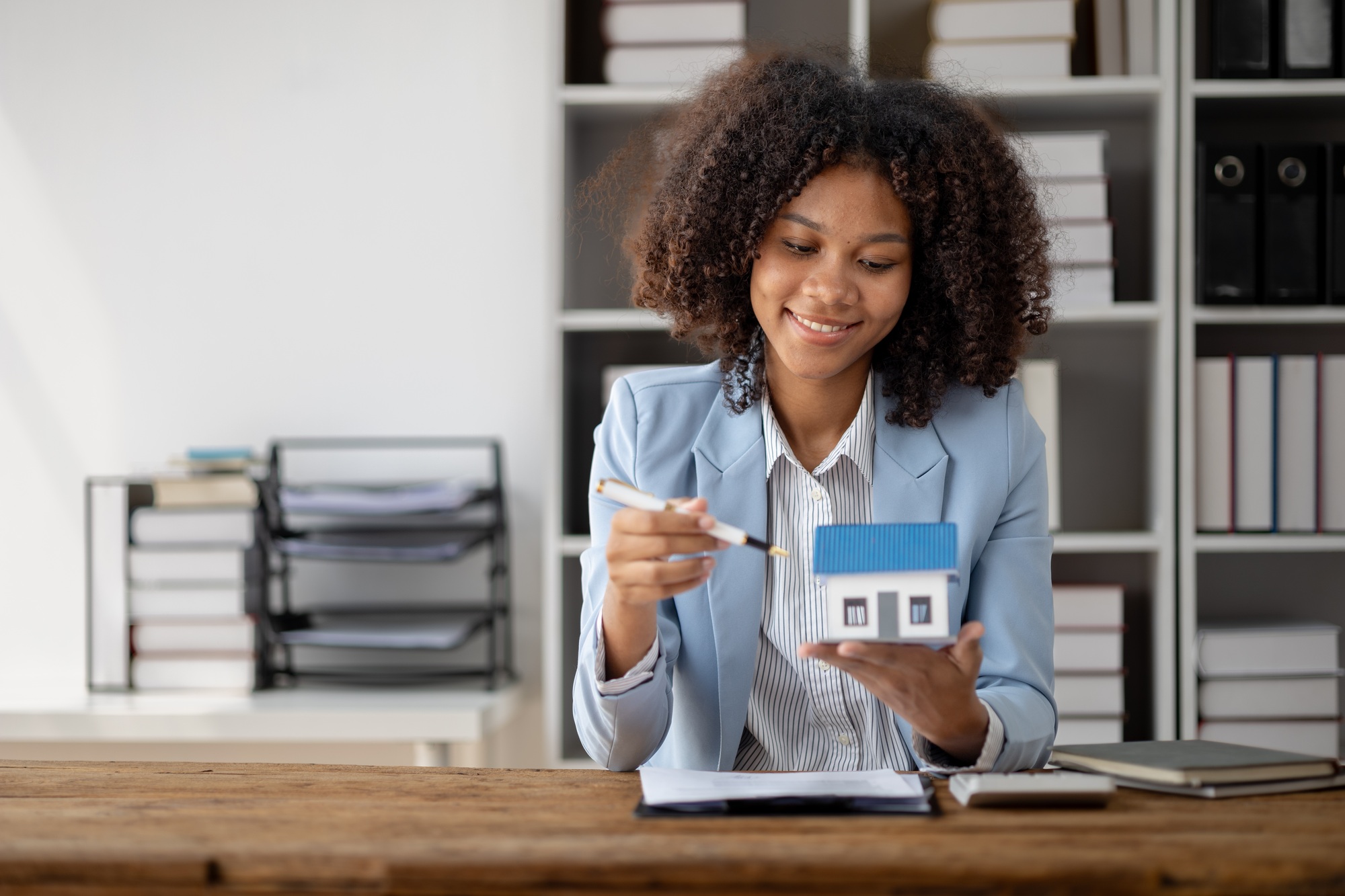 An American woman is a land and real estate broker for houses and condos, she is a real estate broke