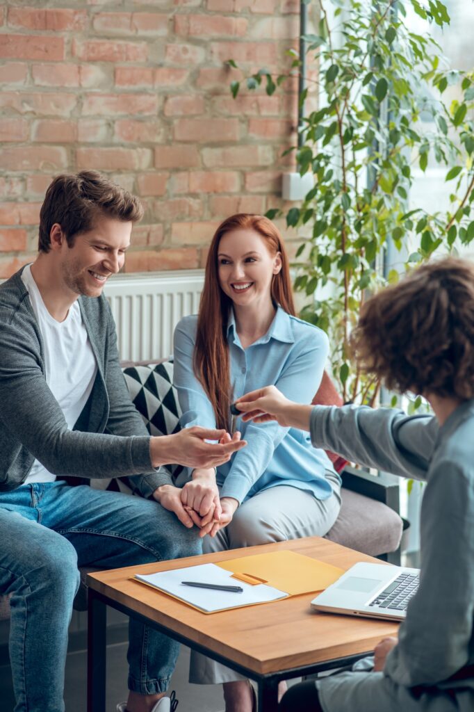 Broker giving buyer real estate key